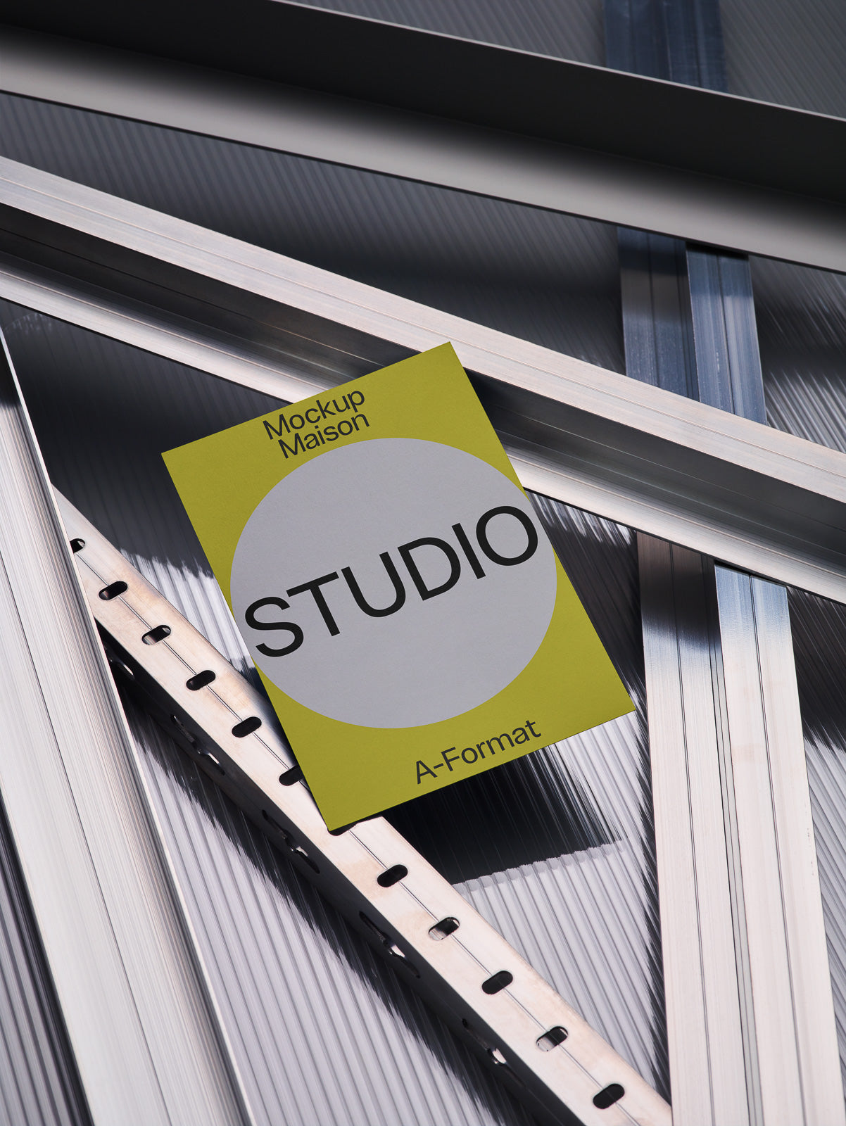 PSD mockup of a studio brochure with yellow and gray design, placed on overlapping metallic beams.