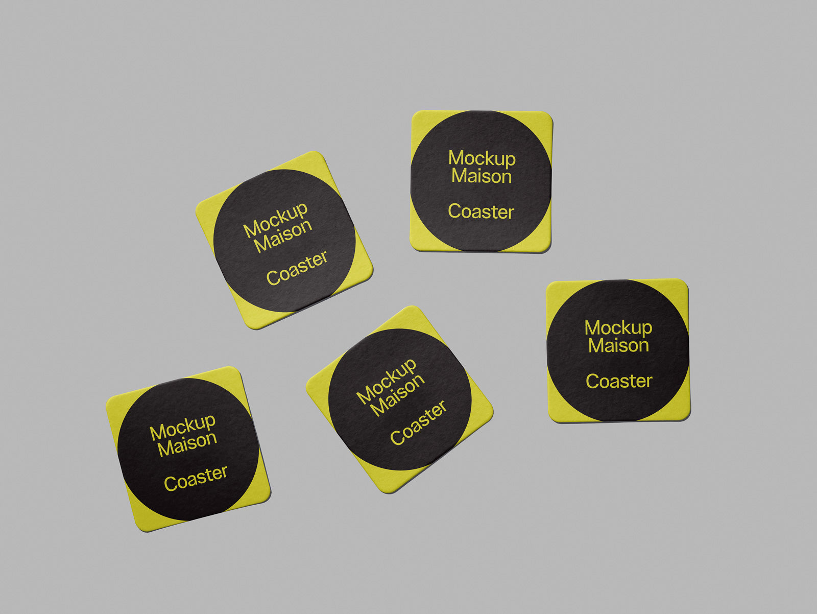 PSD mockup of five yellow and black square coasters with "Mockup Maison Coaster" text on each, arranged on a neutral gray background.