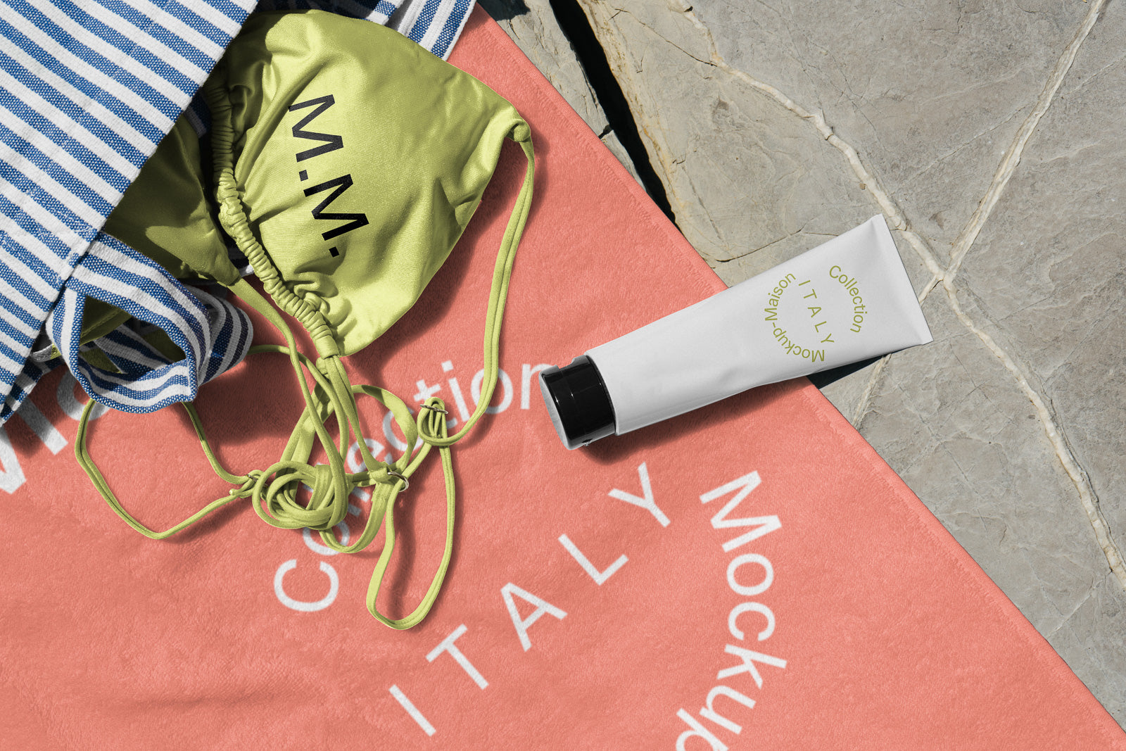 PSD mockup of a striped fabric bag and green pouch on a coral towel with "Collection Italy" print; includes a white tube on stone surface.