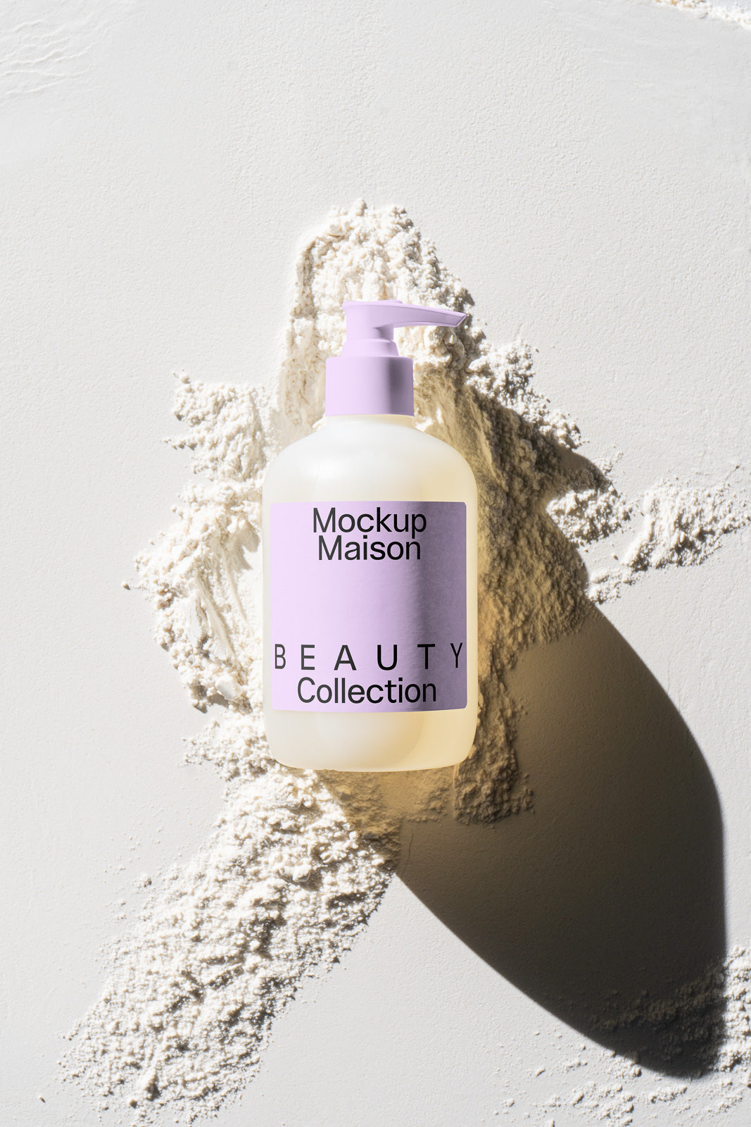 PSD mockup of a beauty product bottle with a purple pump and label reading "Mockup Maison Beauty Collection," placed against a textured white background.