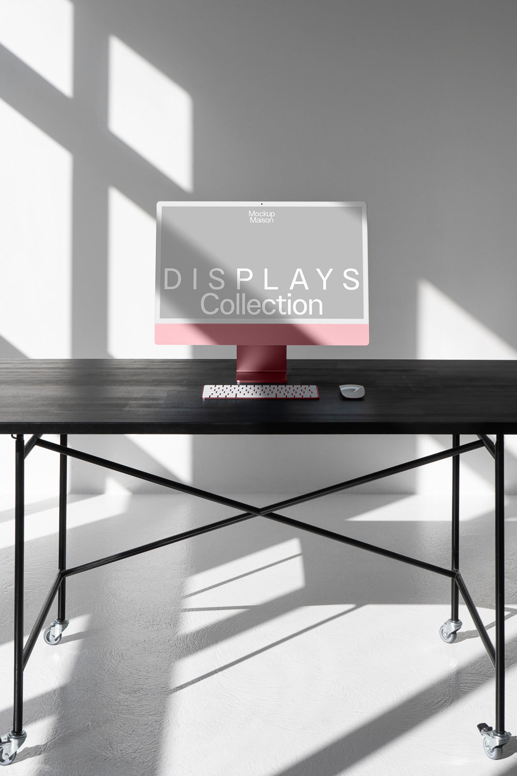 PSD mockup of a sleek desktop computer on a minimalist black metal table with a keyboard and mouse, set in a well-lit room with sunlight casting shadows.