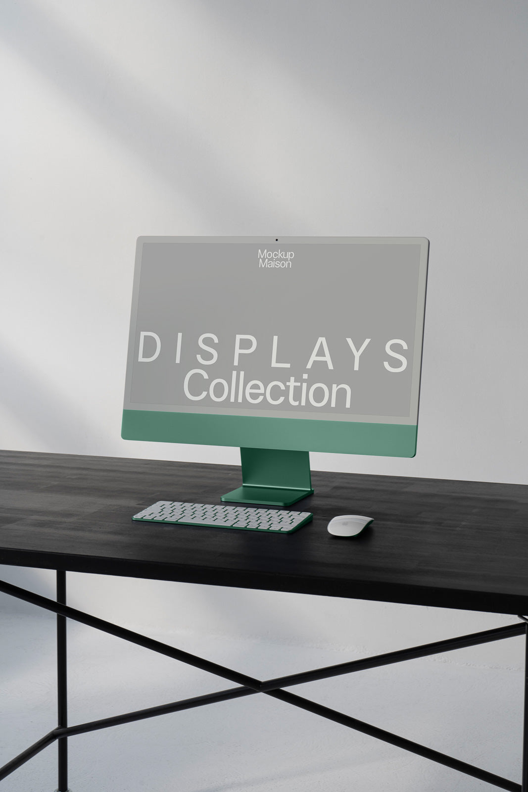 PSD mockup of a green monitor with the text "Displays Collection" on the screen, placed on a dark desk with a keyboard and mouse.