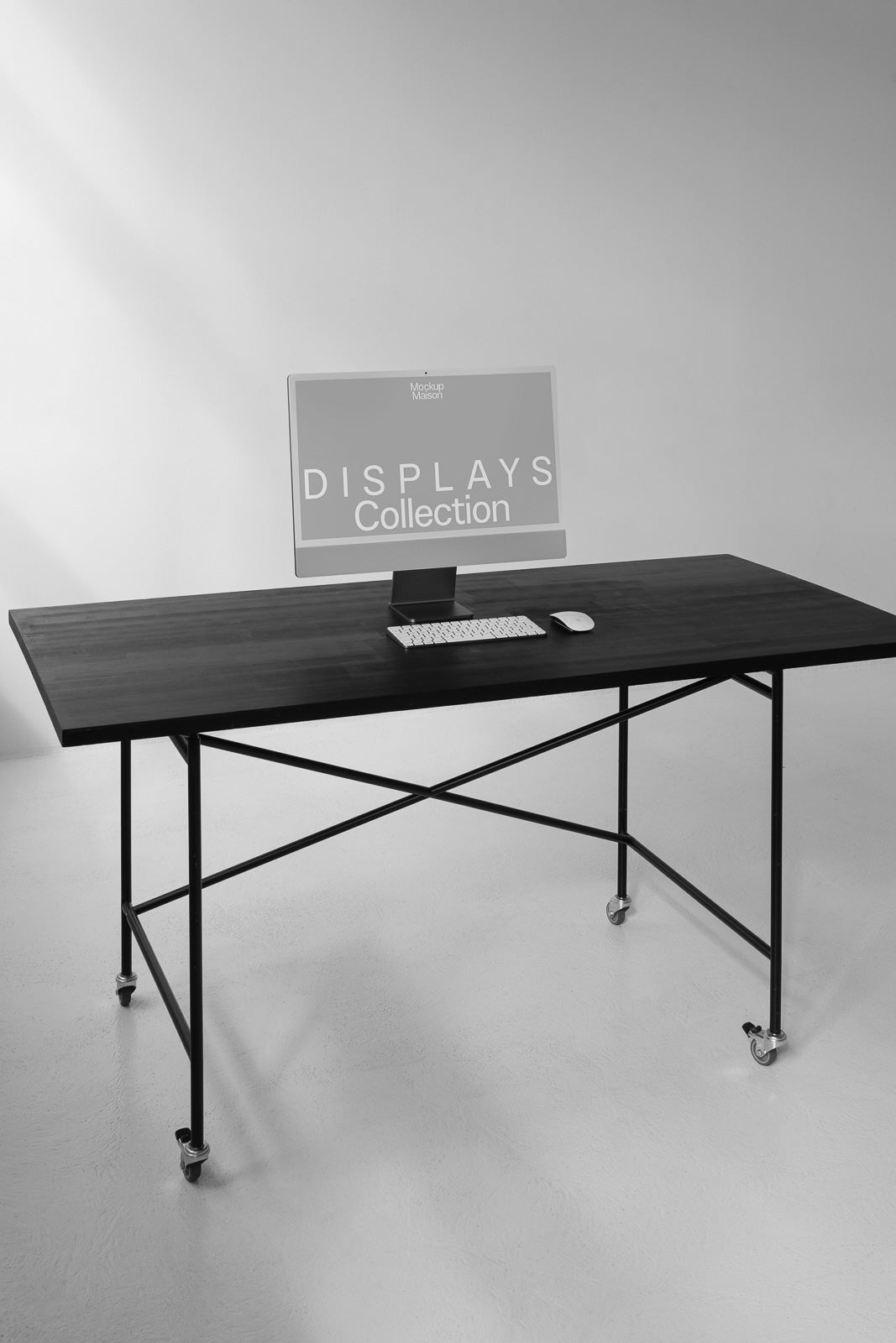 PSD mockup of a minimalist desk setup with a computer monitor displaying "Displays Collection" on a wooden table with a keyboard and mouse.
