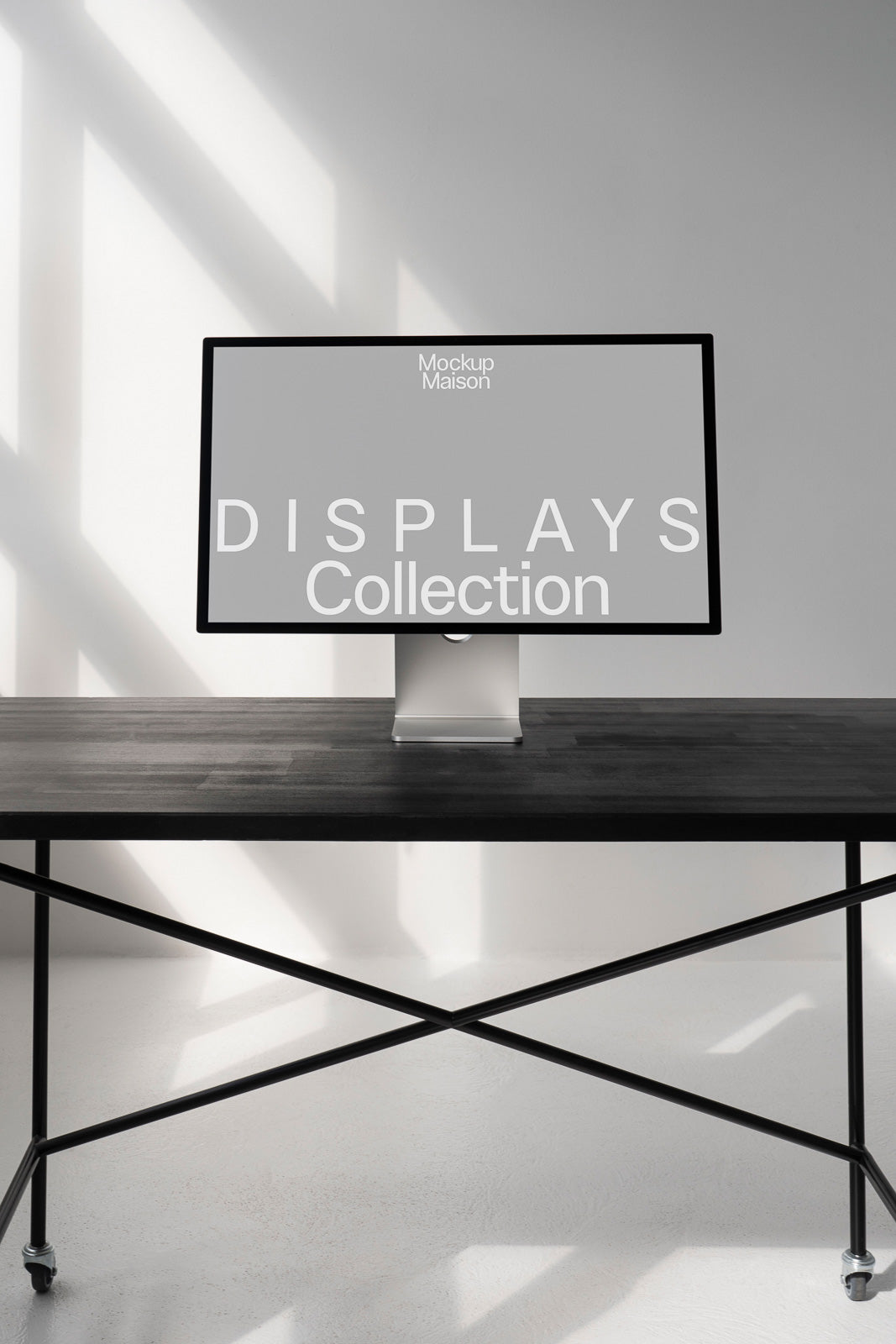 PSD mockup of a modern computer monitor displaying the text "Displays Collection" on a black table with metal legs, casting shadows on a light background.