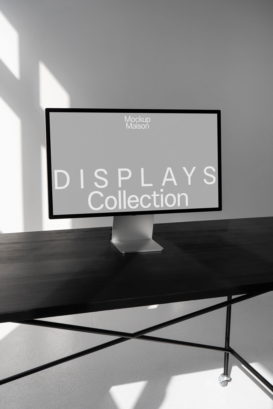 PSD mockup of a monitor displaying "Displays Collection" on a sleek desk with natural lighting and shadows.