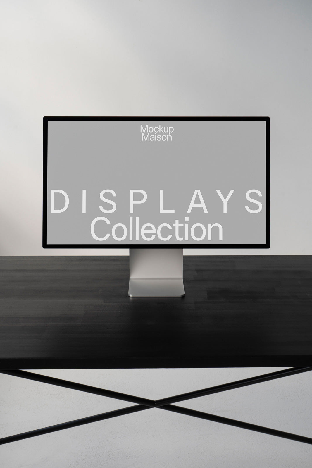 PSD mockup of a sleek computer monitor on a dark wooden desk, displaying the words "Displays Collection" from Mockup Maison on the screen.
