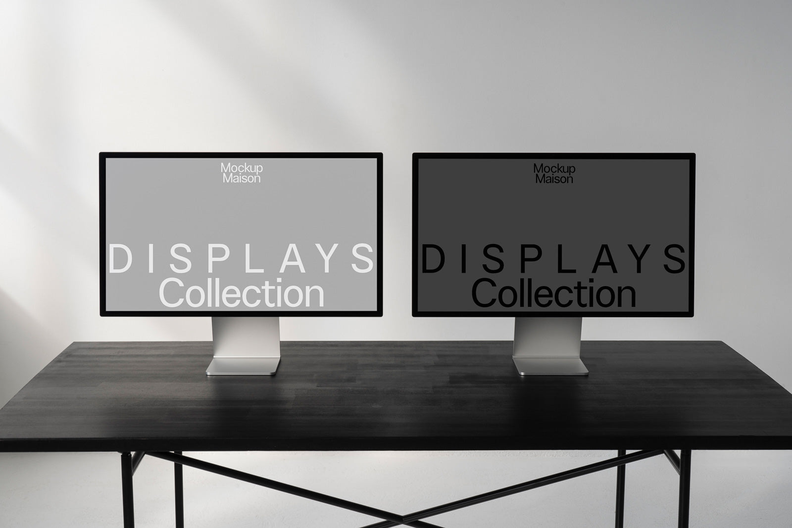 PSD mockup of two computer monitors displaying the text "Displays Collection" on a wooden table in a minimalist setting.