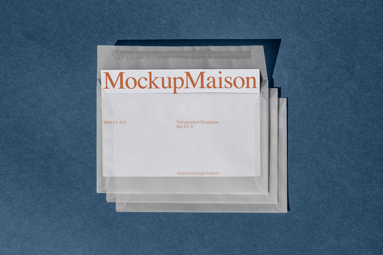 PSD mockup of transparent envelopes with a branded card on top, placed on a textured blue background.