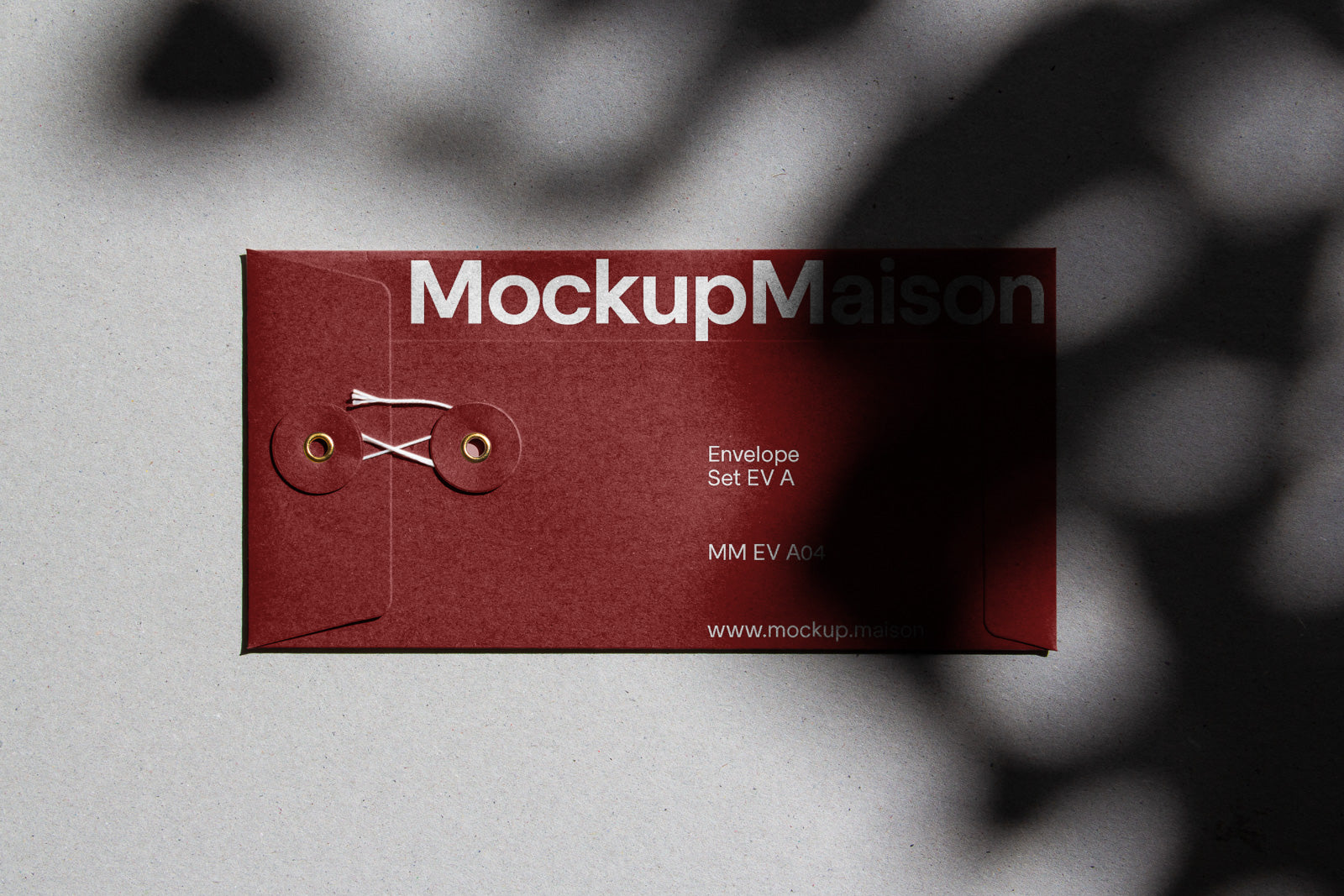 PSD mockup of a red envelope with string tie closure against a textured background, featuring the text “MockupMaison” and shadow patterns.