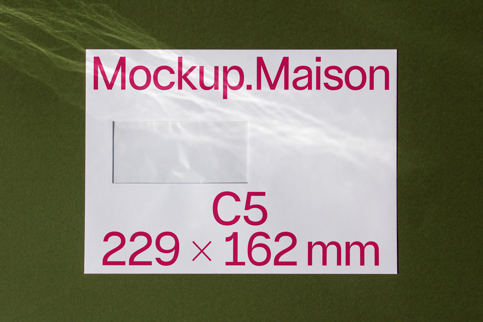 PSD mockup of a C5 envelope with dimensions 229 x 162 mm, featuring the text "Mockup.Maison" in large, bold letters, on a green background.