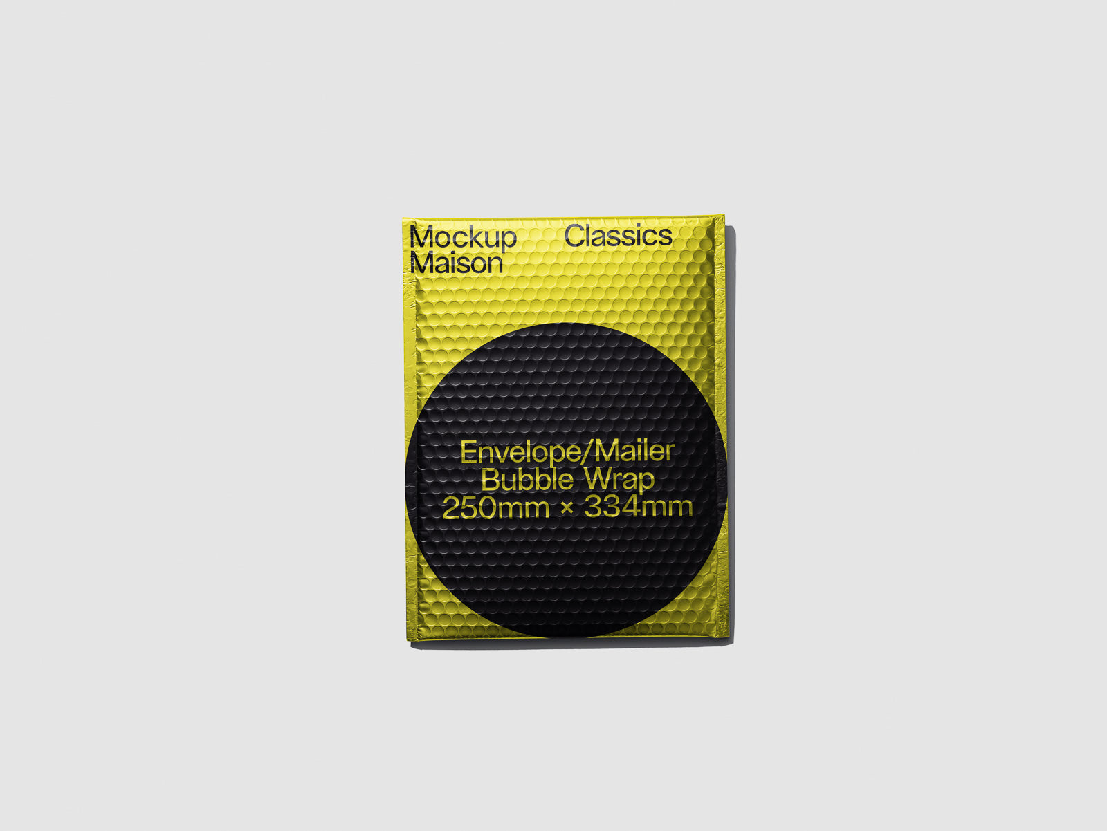 PSD mockup of a yellow bubble wrap envelope with a black circle design, labeled "Envelope/Mailer Bubble Wrap 250mm x 334mm" on the front.