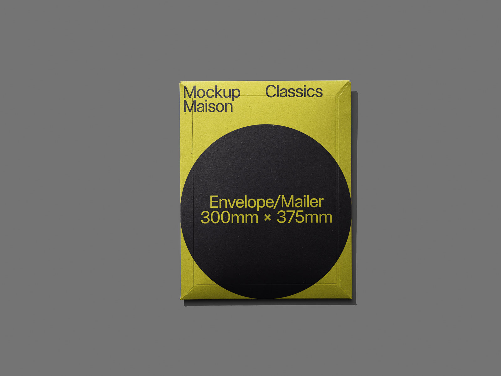 PSD mockup of a yellow and black envelope mailer with the text "Mockup Maison Classics" and "Envelope/Mailer 300mm x 375mm" displayed on a gray background.