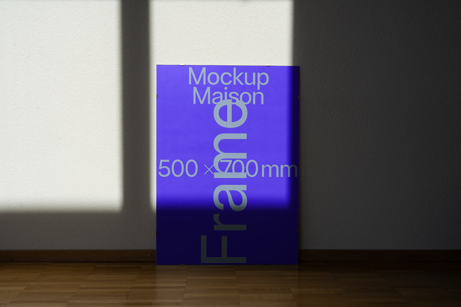 PSD mockup of a purple poster with "Mockup Maison 500 x 700 mm" text, leaning against a wall with a shadow cast on it.