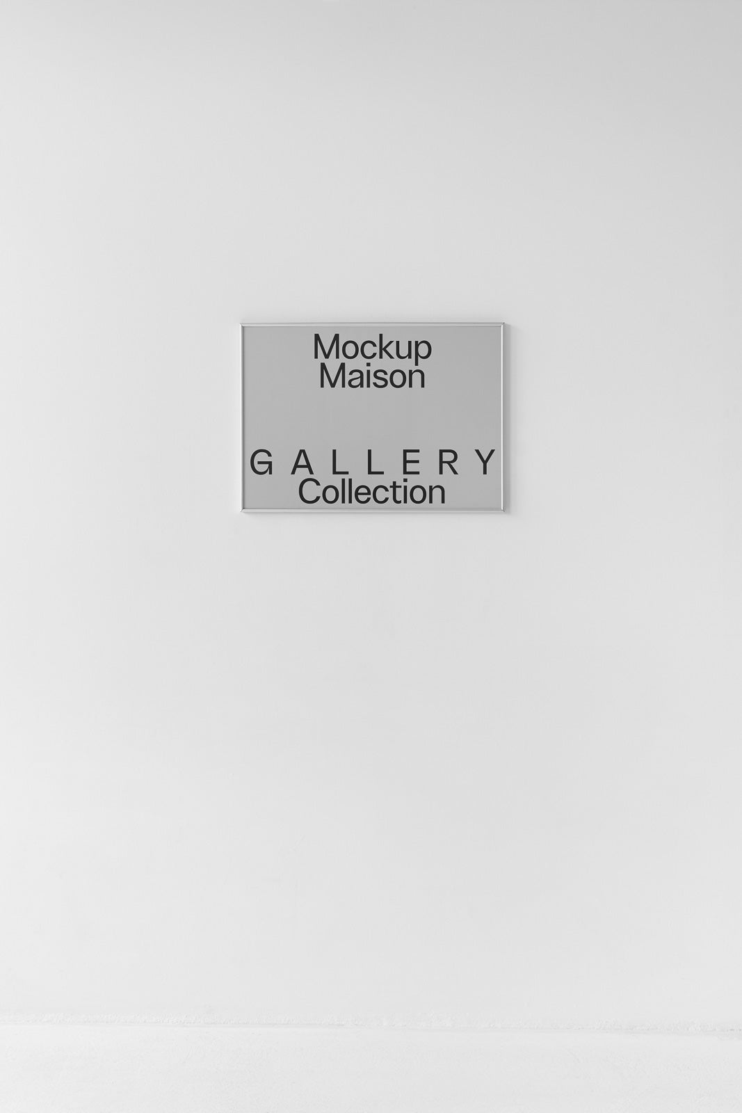 PSD mockup of a framed poster on a white wall, displaying the text "Mockup Maison Gallery Collection" with ample negative space around it.