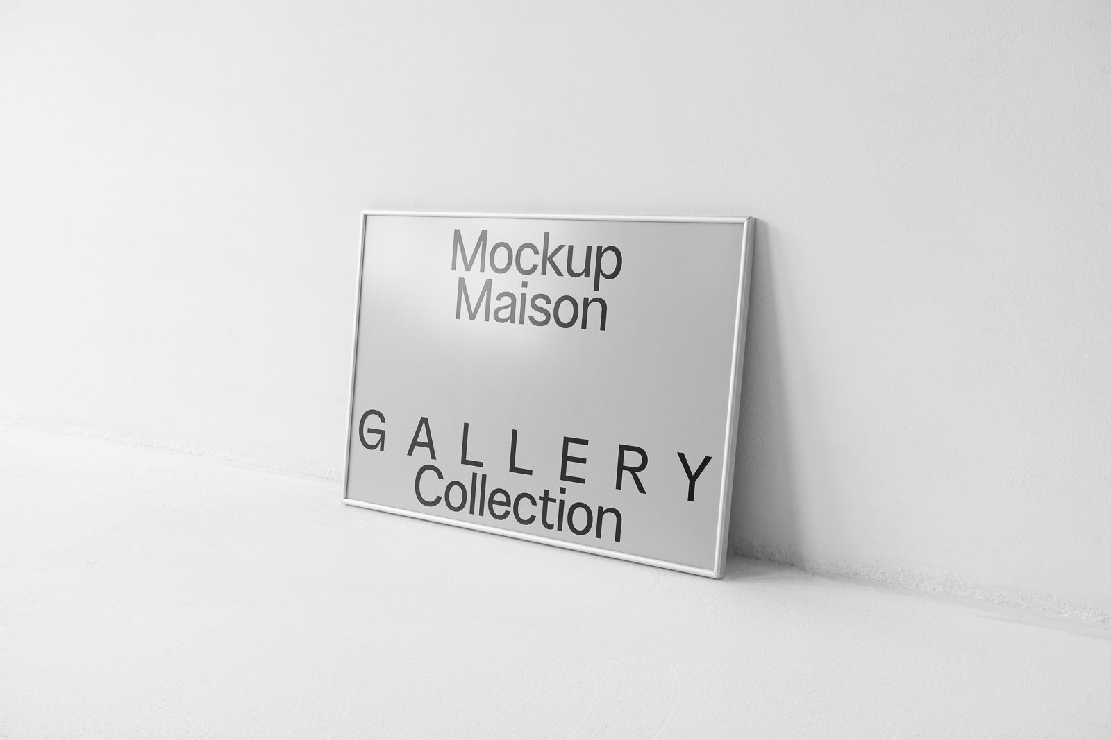 PSD mockup of a framed poster displayed against a plain wall, featuring text "Mockup Maison Gallery Collection" in bold black uppercase letters.