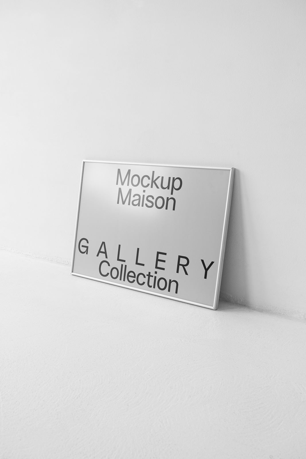 PSD mockup of a framed sign leaning against a white wall, displaying text "Mockup Maison GALLERY Collection" in a minimalist style.