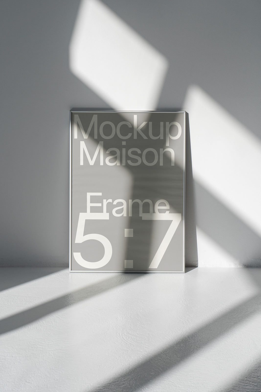 PSD mockup of a 5:7 frame leaning against a wall, with sunlight casting dynamic shadows on the surface.