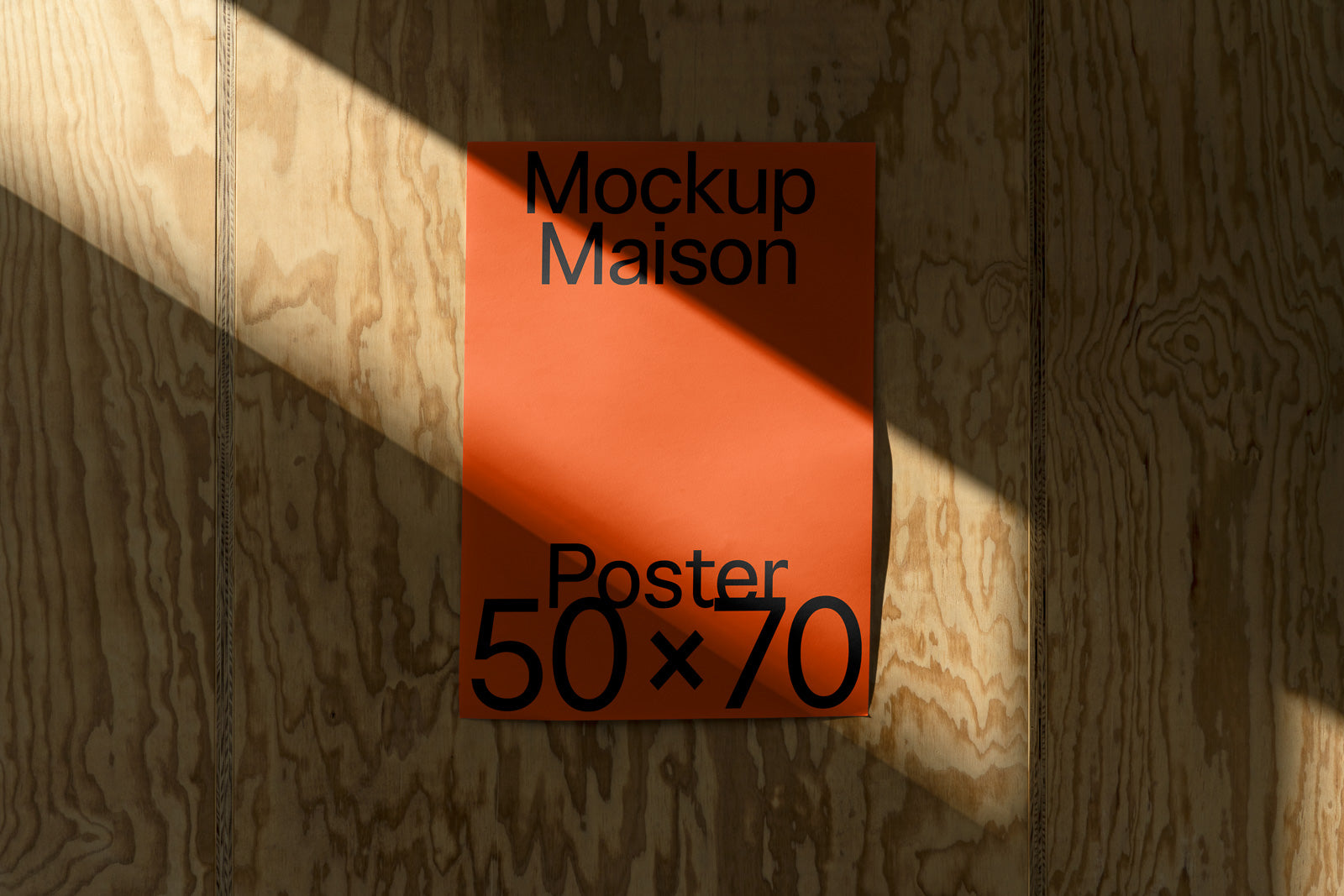 PSD mockup of an orange poster measuring 50x70 cm, displayed on a wooden wall. Sunlight creates diagonal shadows across the poster and wall.