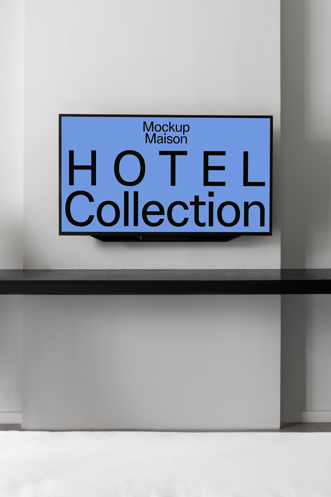 PSD mockup of a flat-screen TV mounted on a light gray wall with "Hotel Collection" text displayed, framed by a sleek black shelf.