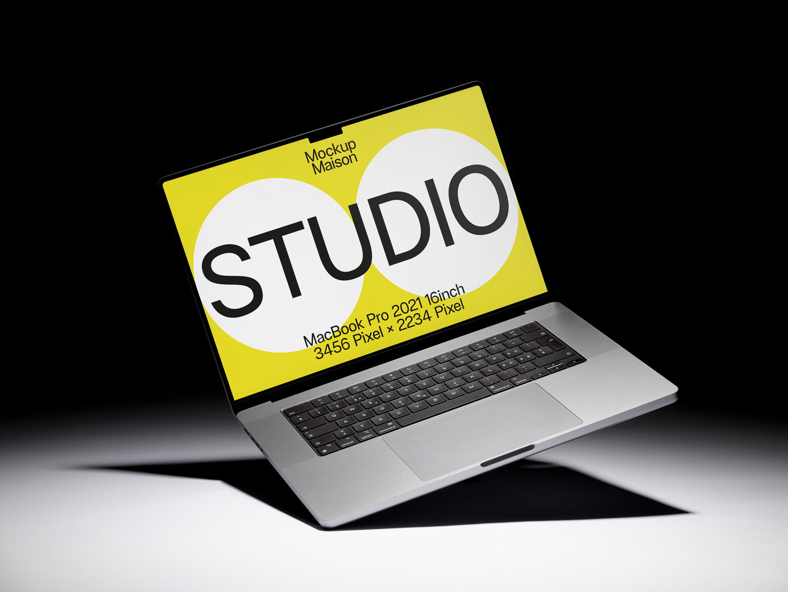 PSD mockup of a MacBook Pro 2021 with a vibrant yellow screen displaying the word "STUDIO" and specifications: 16-inch, 3456x2234 pixels.