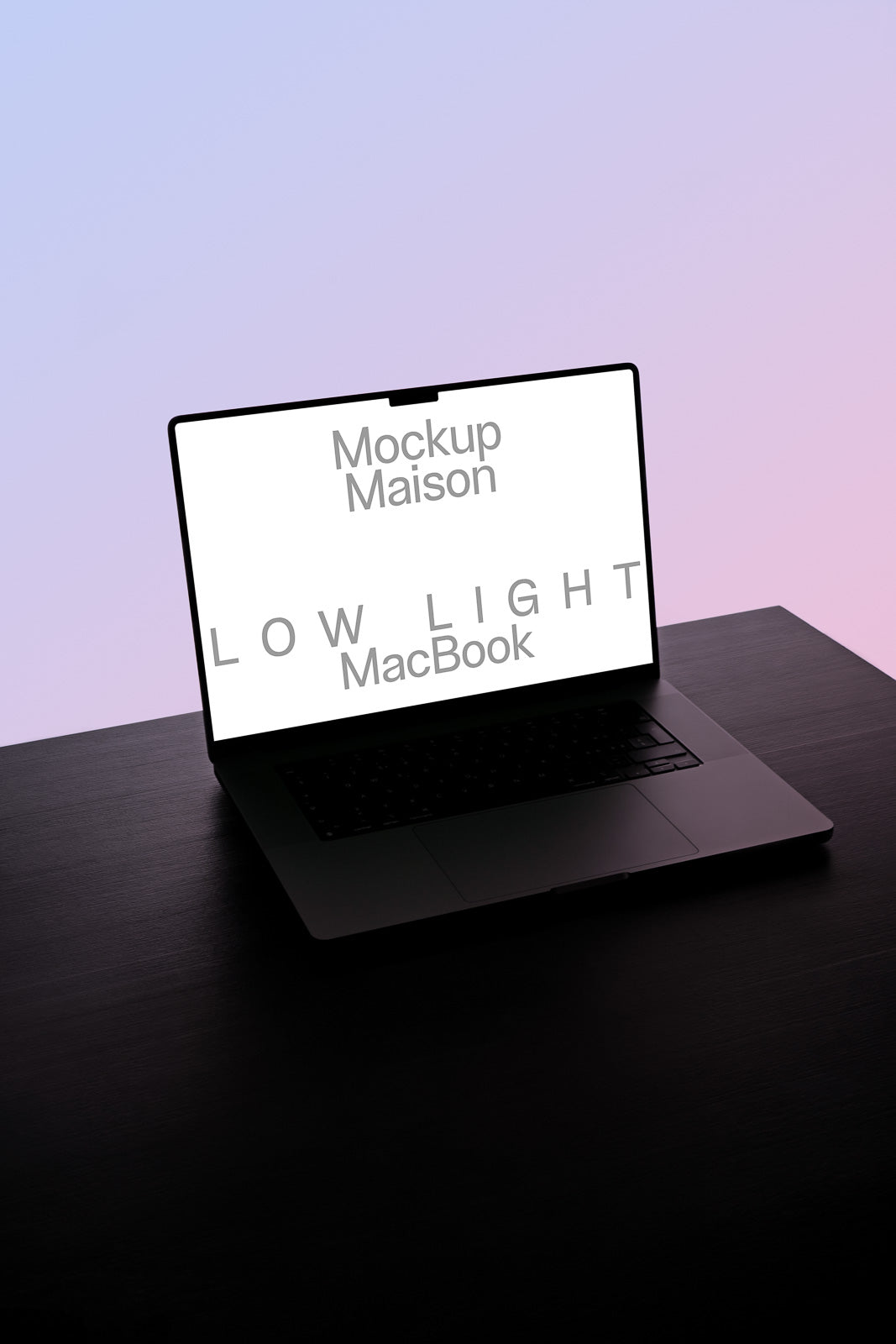 PSD mockup of a MacBook screen displaying the text "Mockup Maison LOW LIGHT MacBook" on a desk with a gradient purple background.