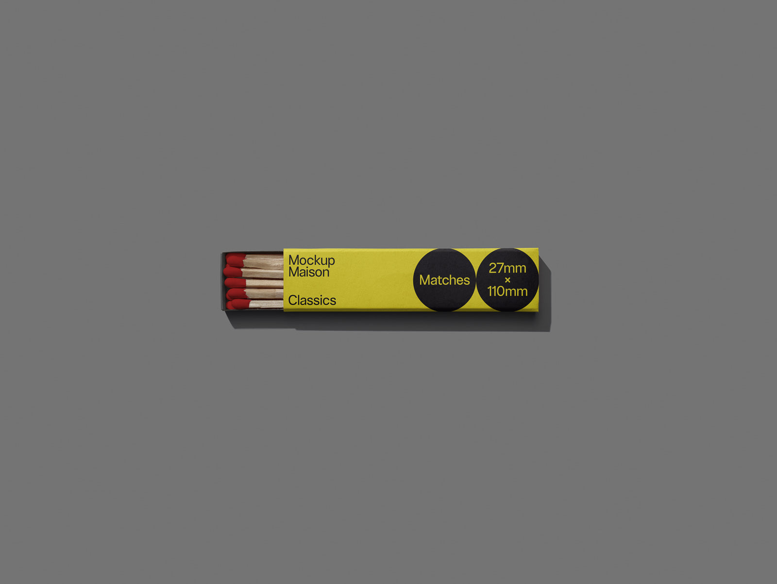 PSD mockup of an opened matchbox with a yellow sleeve labeled "Mockup Maison Classics," displaying matches on a gray background.