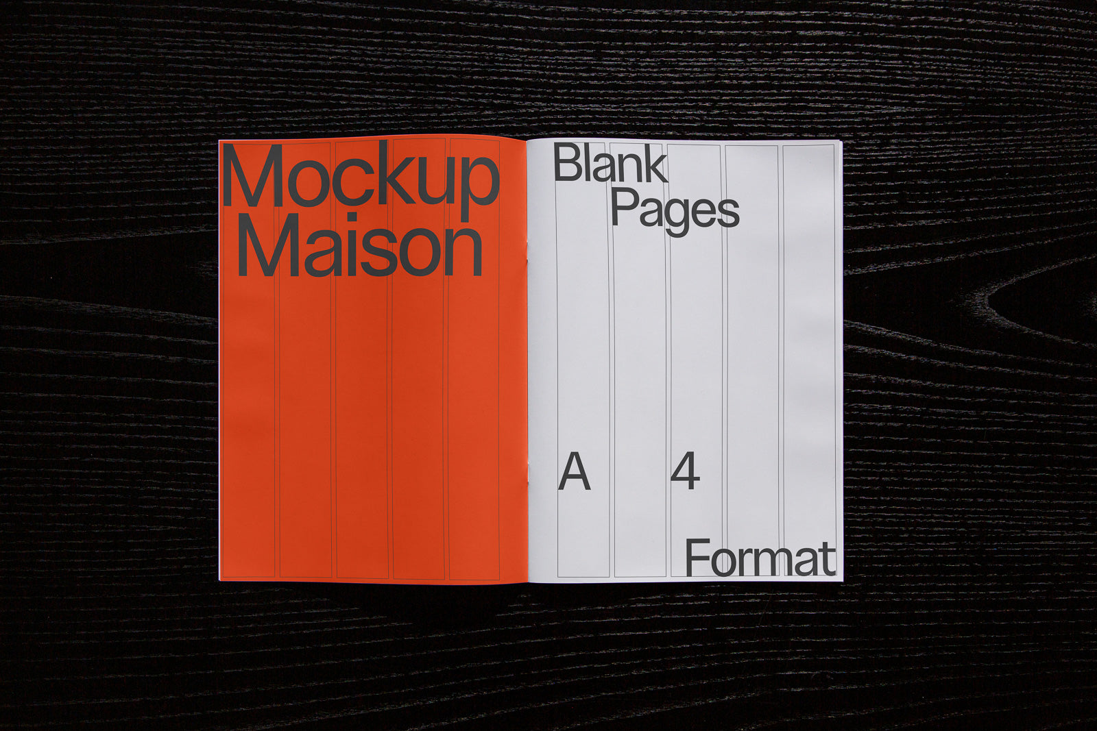 PSD mockup of open magazine with an orange left page featuring "Mockup Maison" and a white right page labeled "Blank Pages A4 Format" on a dark textured surface.