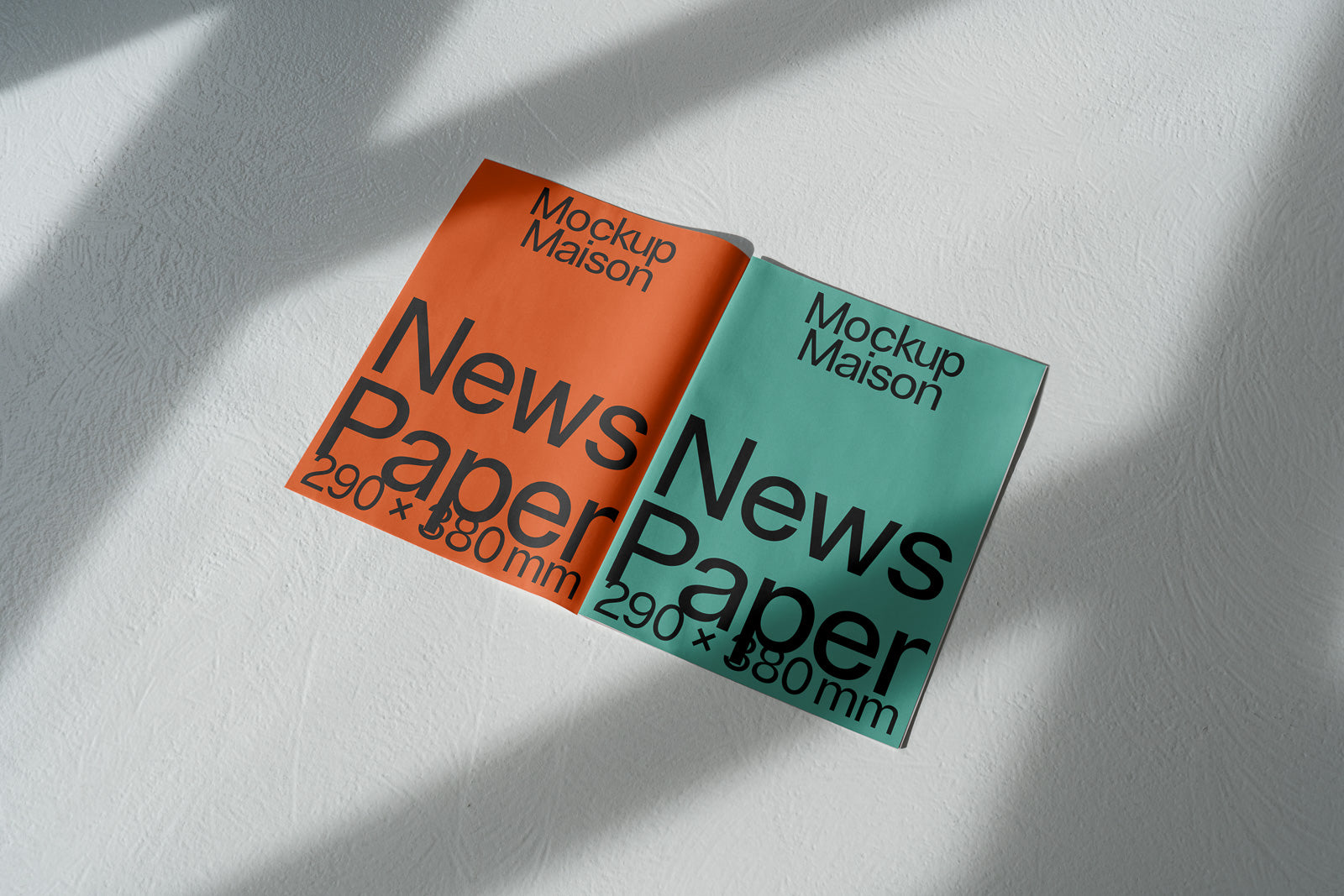 PSD mockup of an open newspaper displaying two pages, one in orange and the other in teal, with "Mockup Maison" and "News Paper 290 x 380 mm" text.