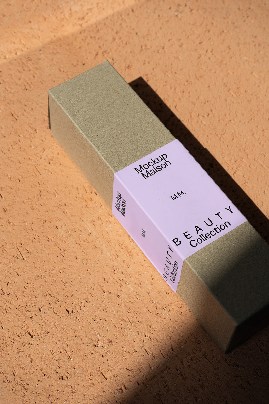 PSD mockup of a rectangular beauty product box with a minimalist design, featuring a lavender label with text, placed on a textured surface.