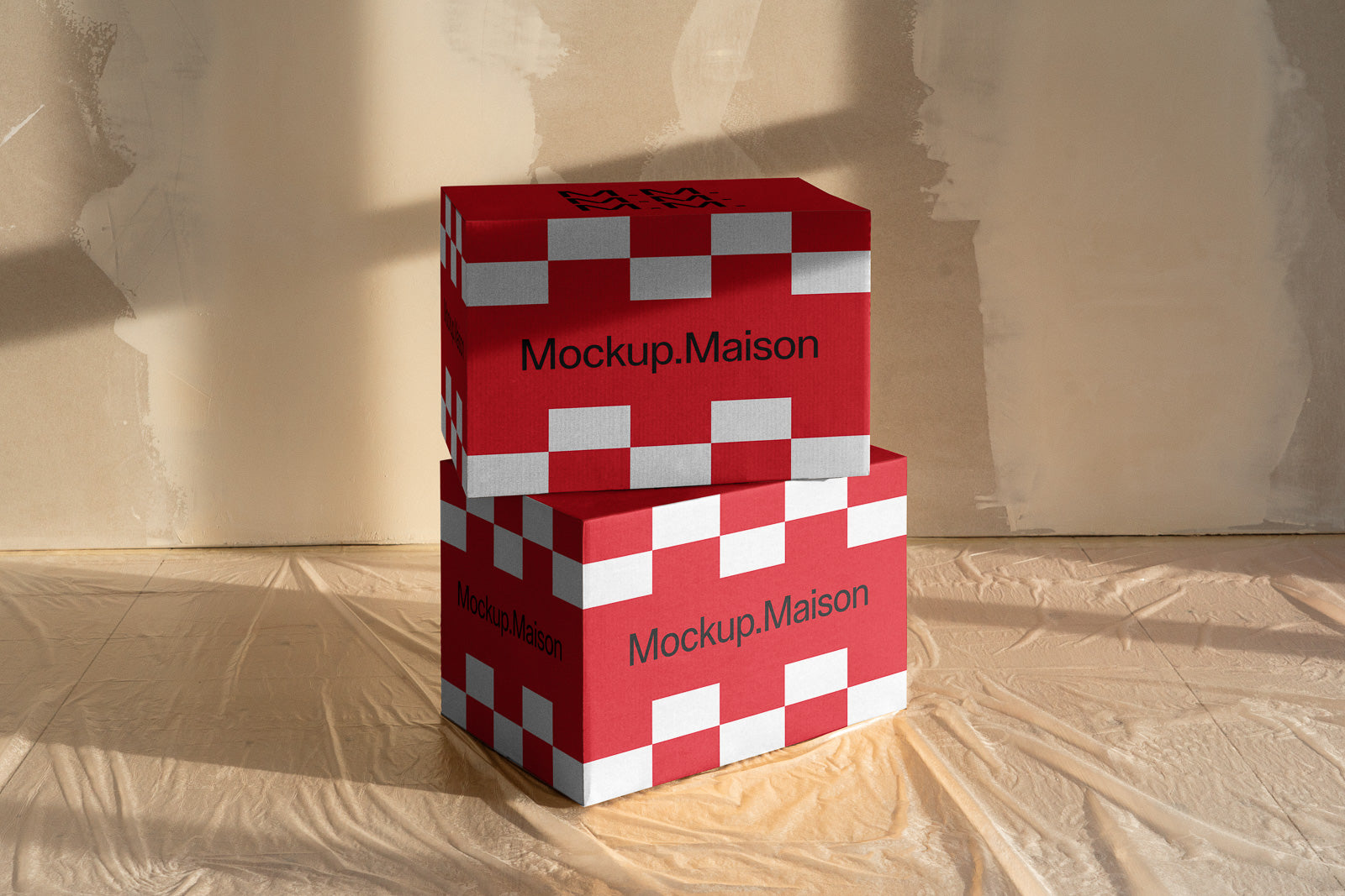 PSD mockup of stacked red and white checkered boxes with "Mockup.Maison" text against a textured beige background.