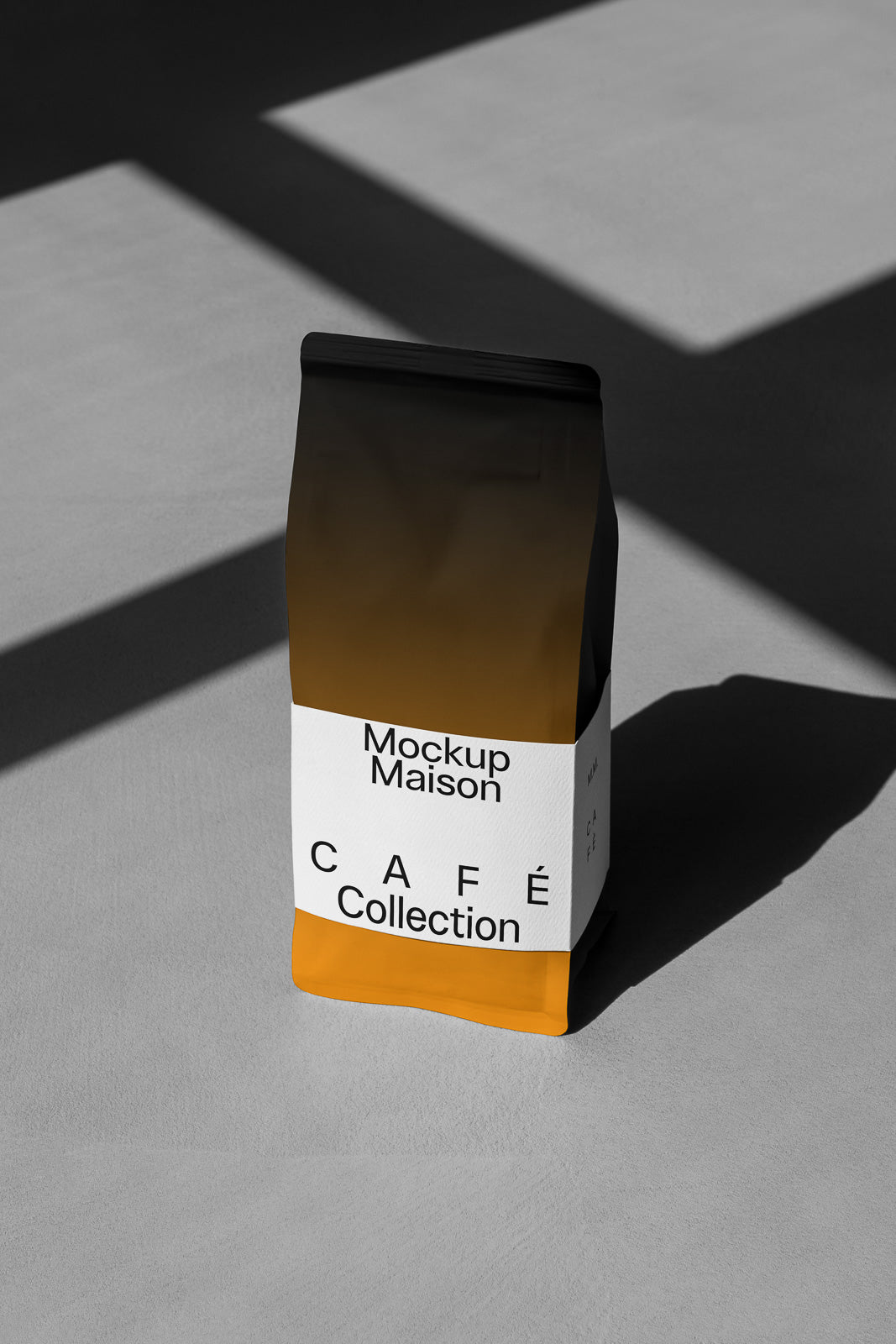 PSD mockup of a modern coffee bag with "Mockup Maison Café Collection" label, featuring a minimalist design with orange and white colors on a concrete surface.