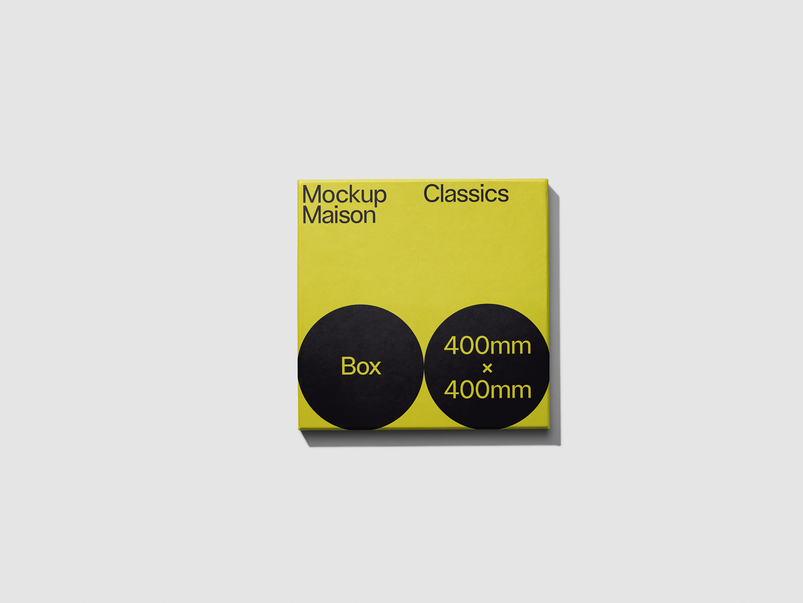 PSD mockup of a yellow square box with the text "Mockup Maison Classics" and two black circles labeled "Box" and "400mm x 400mm."