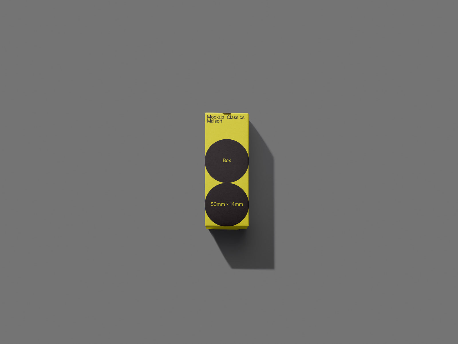 PSD mockup of a yellow box labeled "Mockup Maison Classics" with two black circles and dimensions "50mm x 14mm" on a gray background.