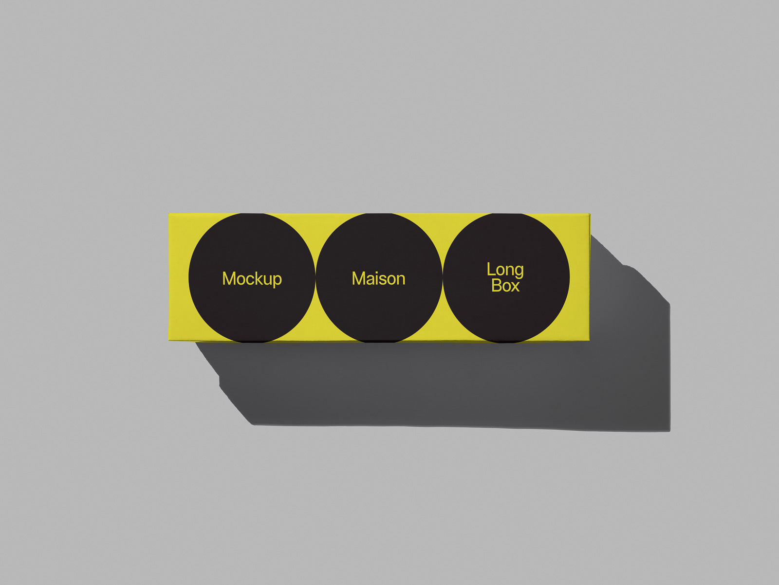 PSD mockup of a yellow, rectangular box featuring three black circles with text labels "Mockup," "Maison," and "Long Box" set against a grey background.