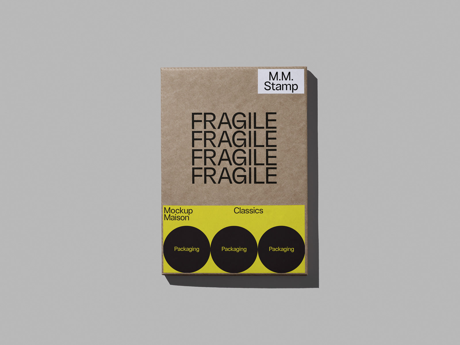 PSD mockup of a cardboard box with "FRAGILE" text repeated, featuring a yellow label with circular designs for packaging display.