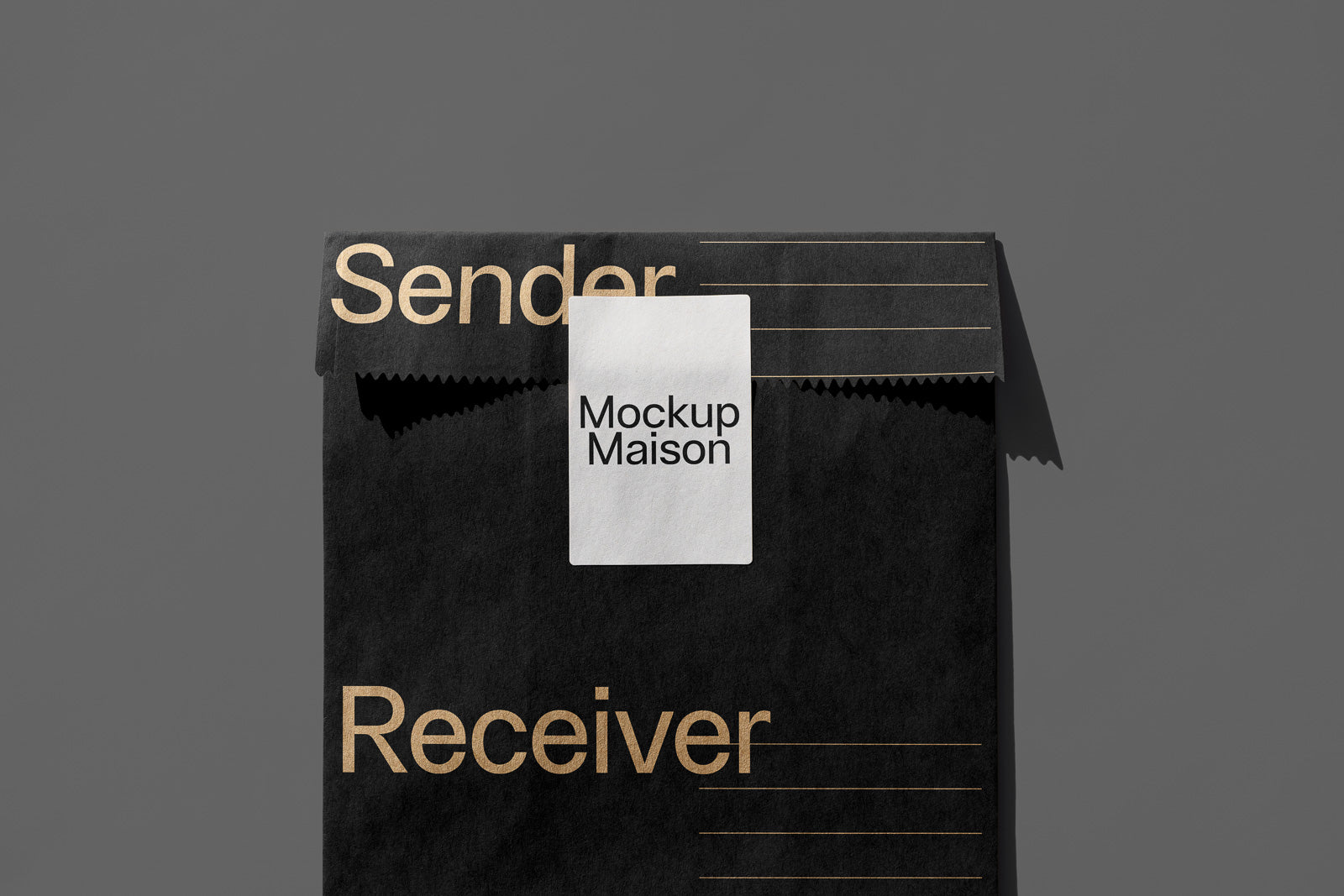 PSD mockup of a black envelope with "Sender" and "Receiver" text in gold. A white label in the center displays the text "Mockup Maison."