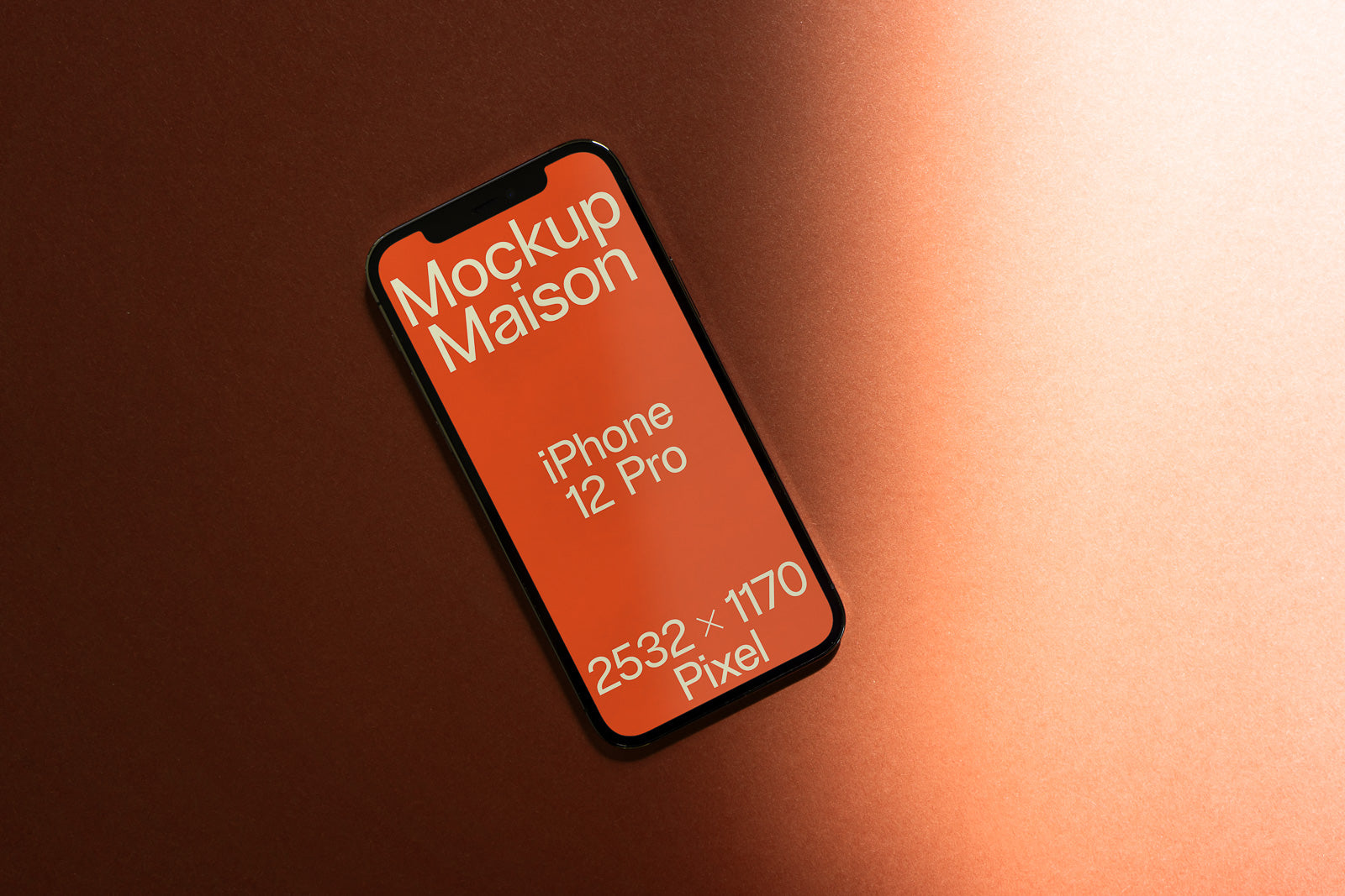 PSD mockup of an iPhone 12 Pro displaying "Mockup Maison" text on an orange screen, set against a textured orange background and soft shadows.