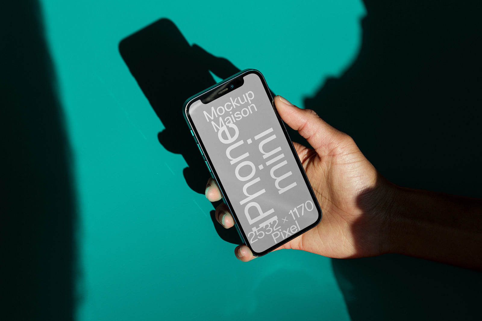 PSD mockup of a hand holding a smartphone with a blank screen, displaying text and dimensions against a turquoise background, capturing shadows.