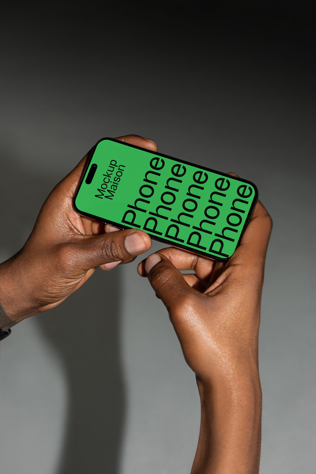 PSD mockup of a smartphone held in hands, displaying a green screen with black text reading "Phone" multiple times.