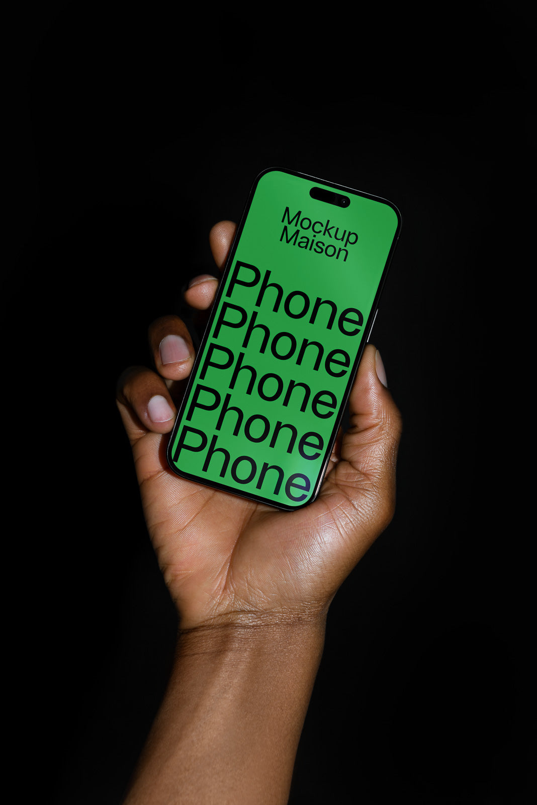 PSD mockup of a hand holding a smartphone with a green screen displaying the words "Mockup Maison Phone" against a black background.