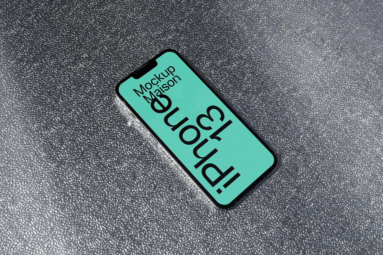 PSD mockup of a smartphone displaying text on a turquoise screen, placed on a textured gray surface.