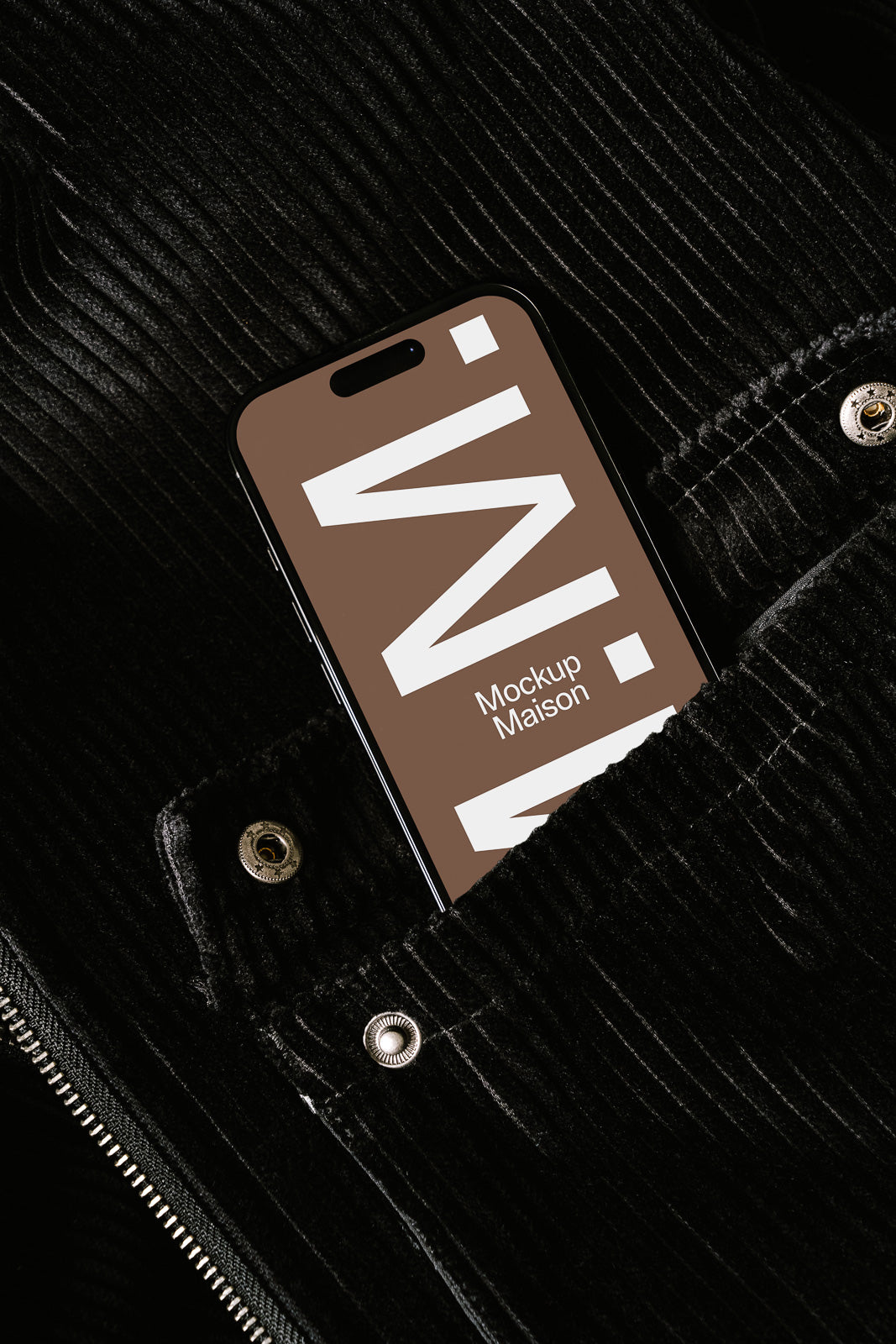 PSD mockup of a smartphone with a brown display, featuring bold white text, partially tucked in a black, textured fabric pocket with metallic buttons.