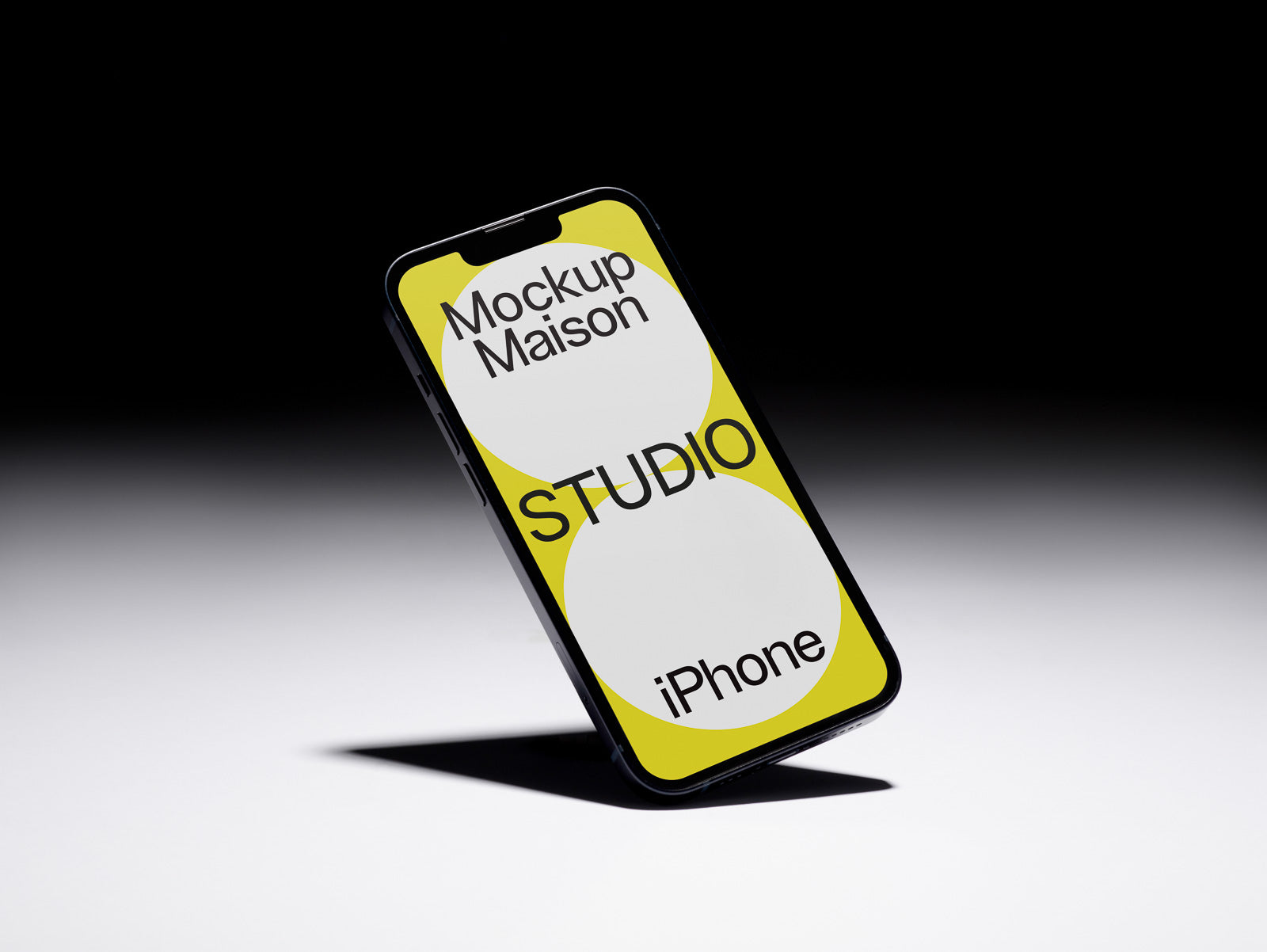 PSD mockup of an iPhone with a yellow and white design, displaying the text "Mockup Maison Studio iPhone" against a dark gradient background.