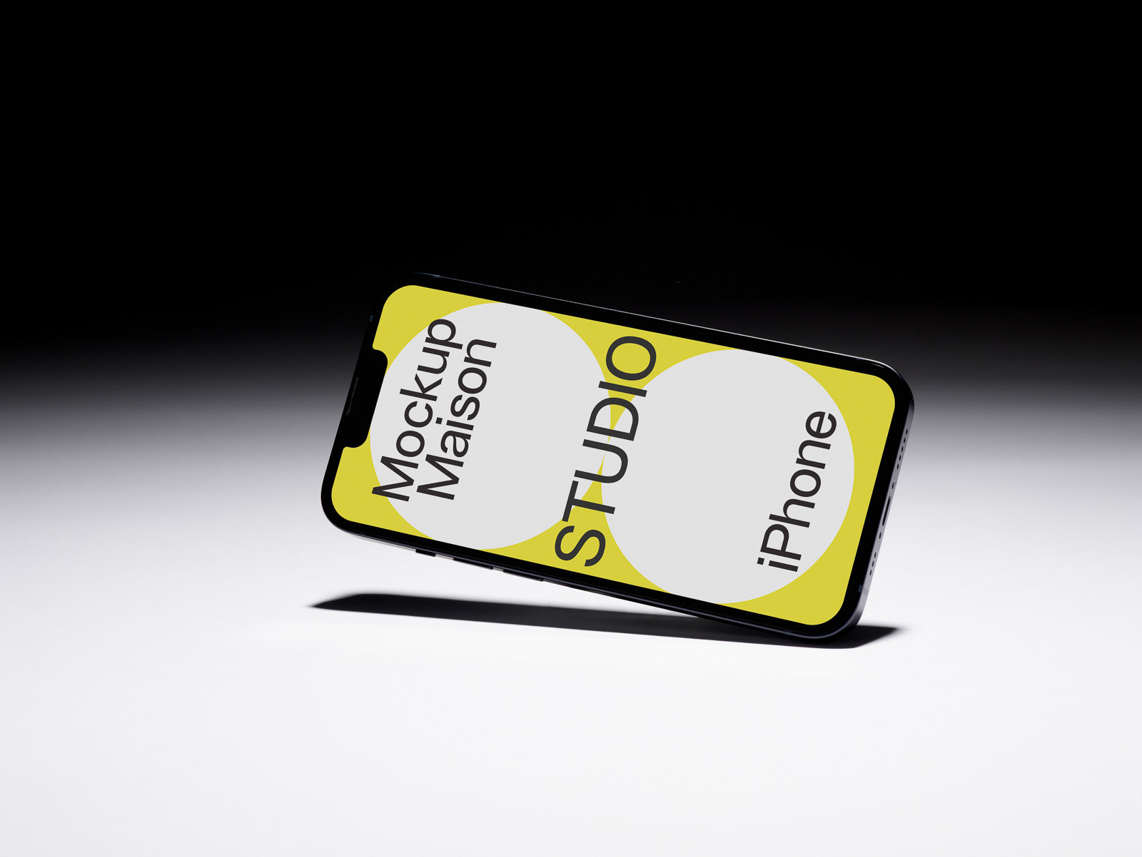 PSD mockup of a tilted smartphone against a gradient background, displaying a design with "Mockup Maison Studio iPhone" on the screen.