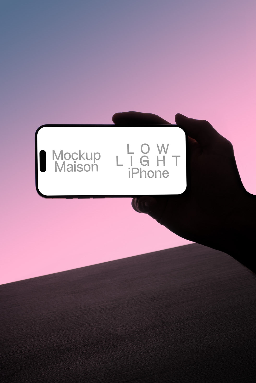 PSD mockup of a hand holding a smartphone with a white screen against a pink and blue gradient background.