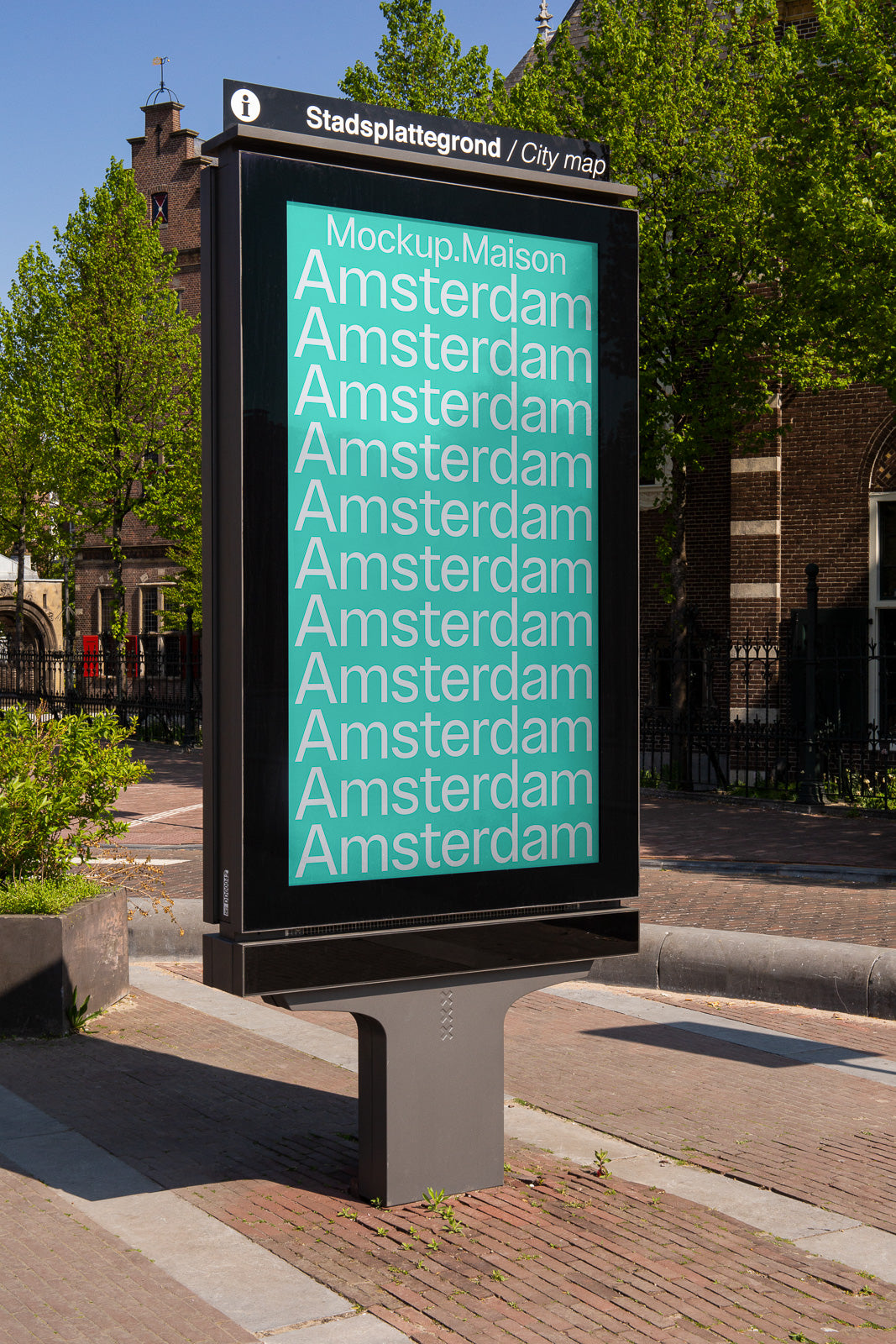 PSD mockup of a city map billboard featuring the word "Amsterdam" repeatedly in white on a teal background, set outdoors near a historic building.