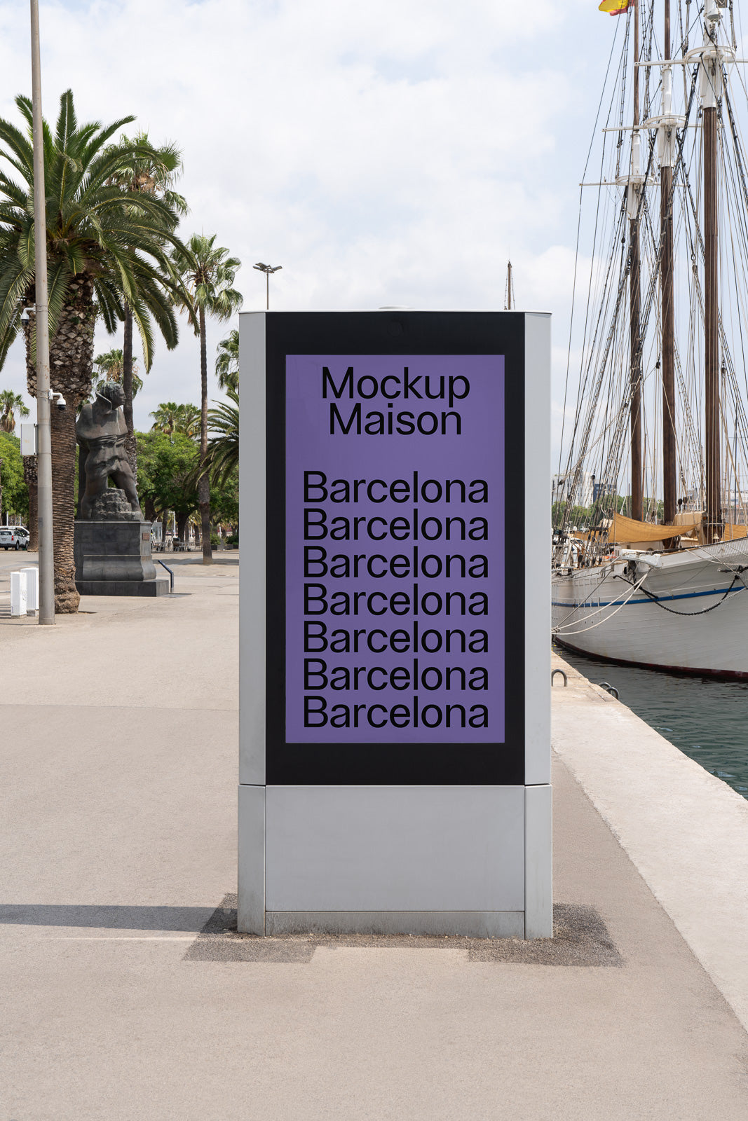 PSD mockup of an outdoor digital kiosk displaying repeated text "Barcelona" under "Mockup Maison" with palm trees and a docked ship in the background.