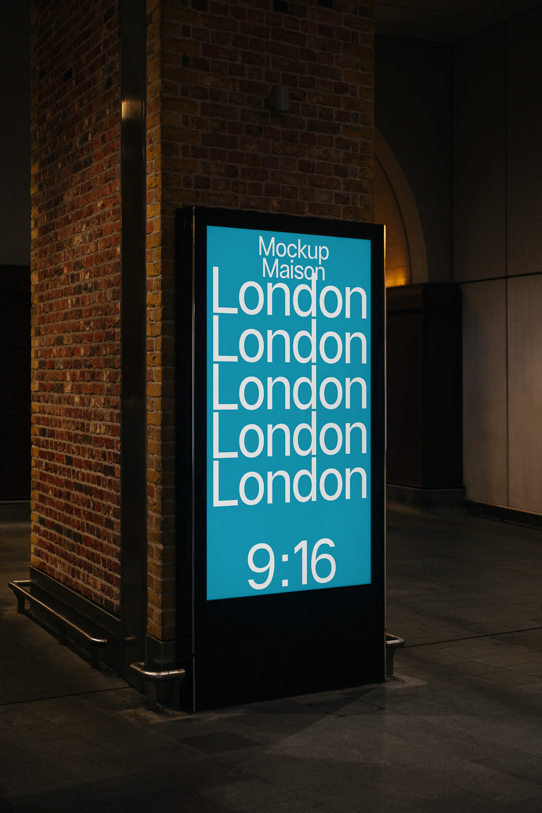 PSD mockup of a digital sign displaying repetitive text "London" on a brick wall background, with a blue screen and the time "9:16" at the bottom.
