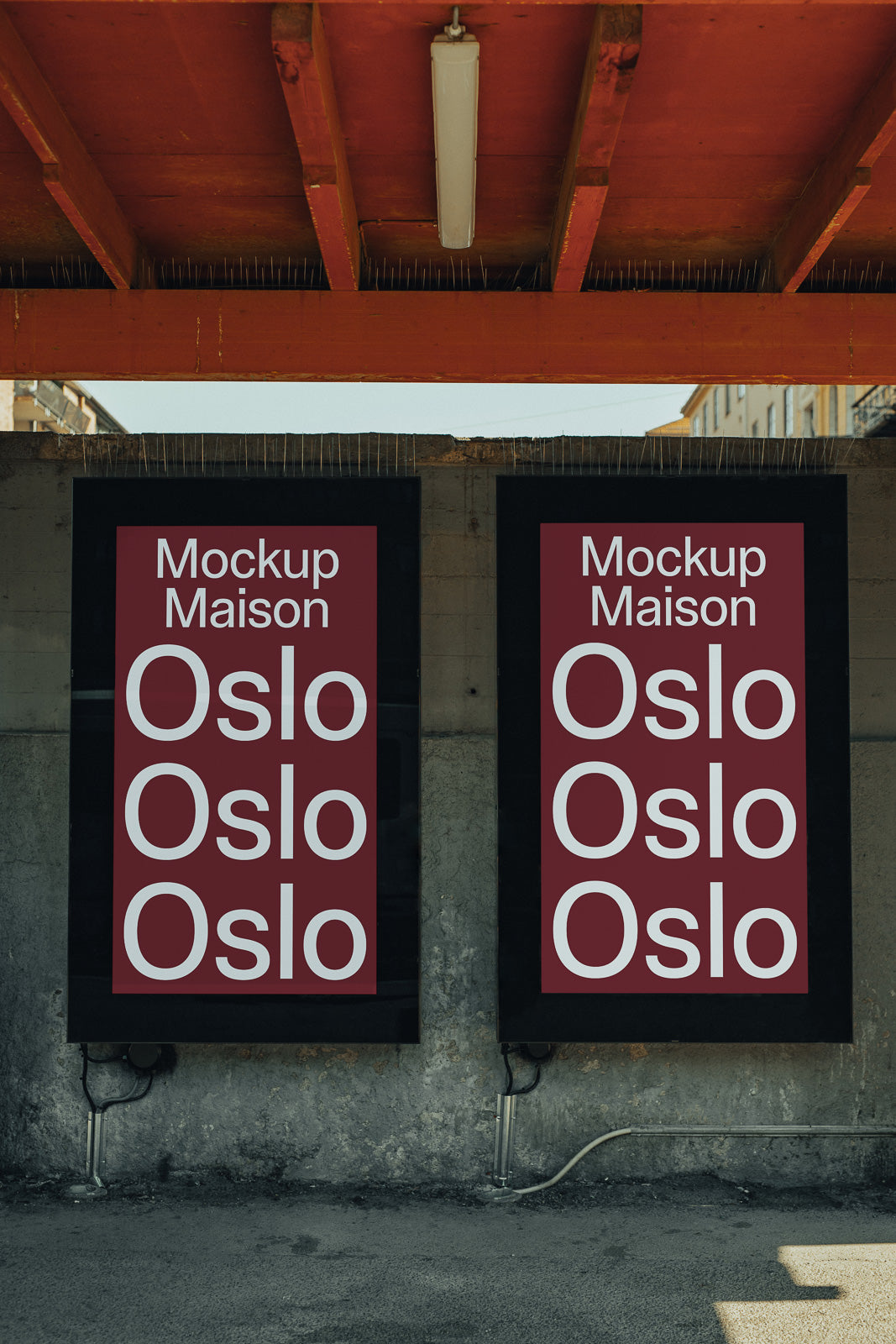 PSD mockup of two vertical posters under a red ceiling, displaying the text "Mockup Maison Oslo" in white on dark red backgrounds.