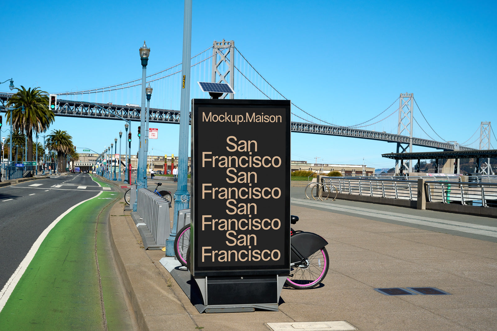 PSD mockup of a street advertisement display in an urban setting, featuring the text "San Francisco" with a backdrop of a suspension bridge and palm trees.